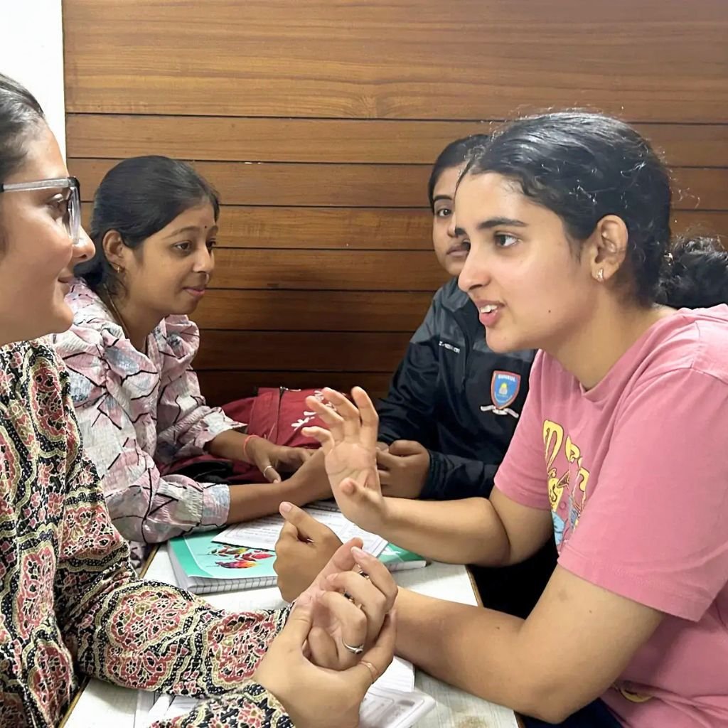 Students practising debate and group discussion at AIM English Raipur