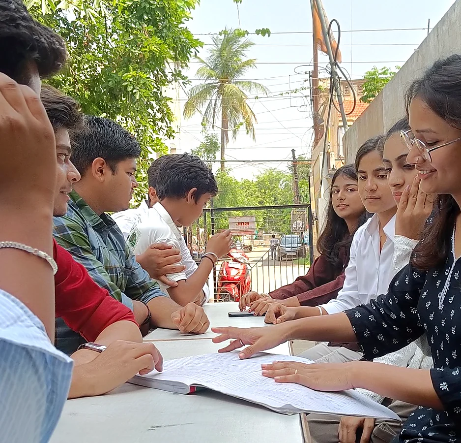 AIM English students participating in a group learning activity outdoors in Raipur