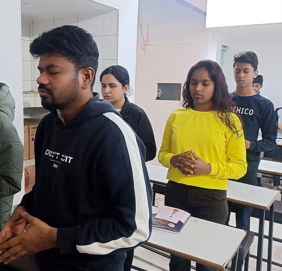 Students practising meditation and visualization during a personality development class at AIM English Raipur