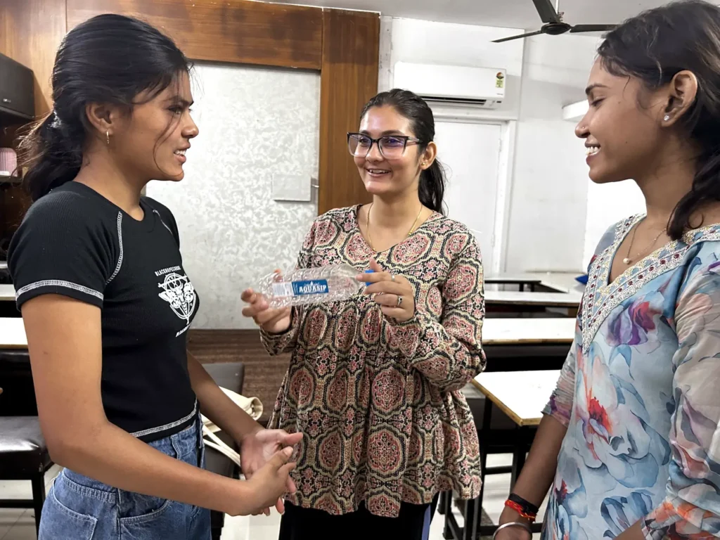 Students practising communication skills during a personality development activity at AIM English Raipur