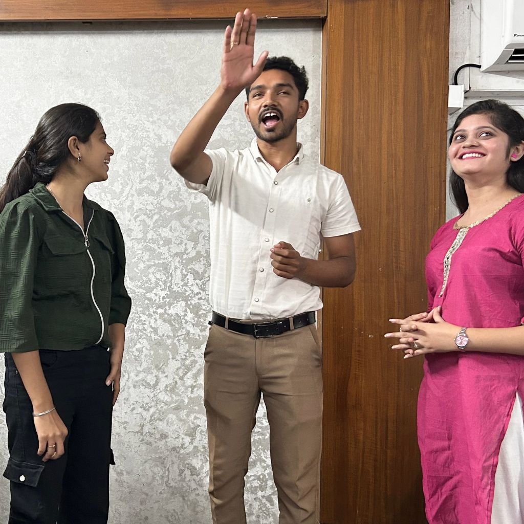 Students participating in a classroom public speaking activity at AIM English Raipur