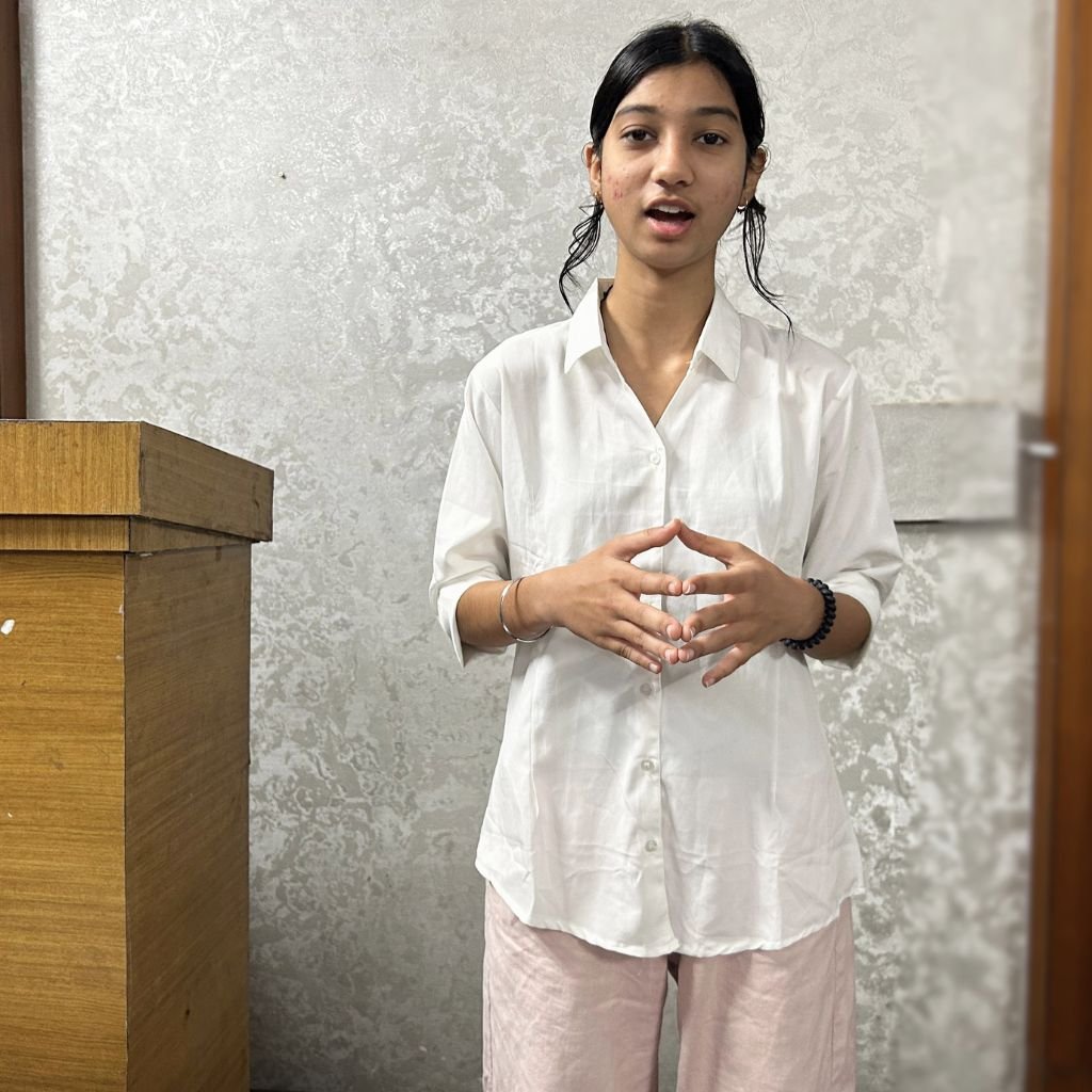 Student delivering a speech during presentation practice at AIM English Raipur